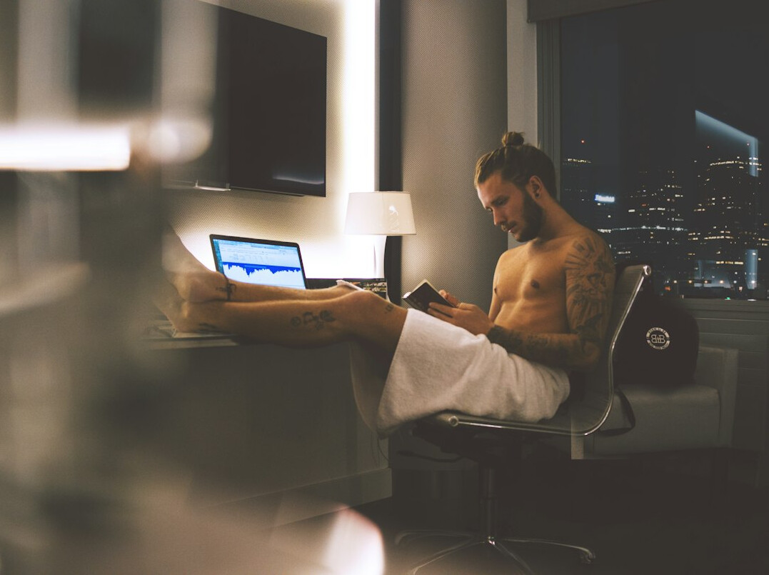 man reading book in office